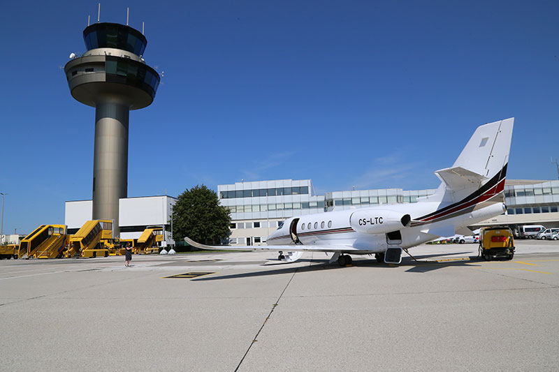 The Cessna Citation Latitude in front of the tower